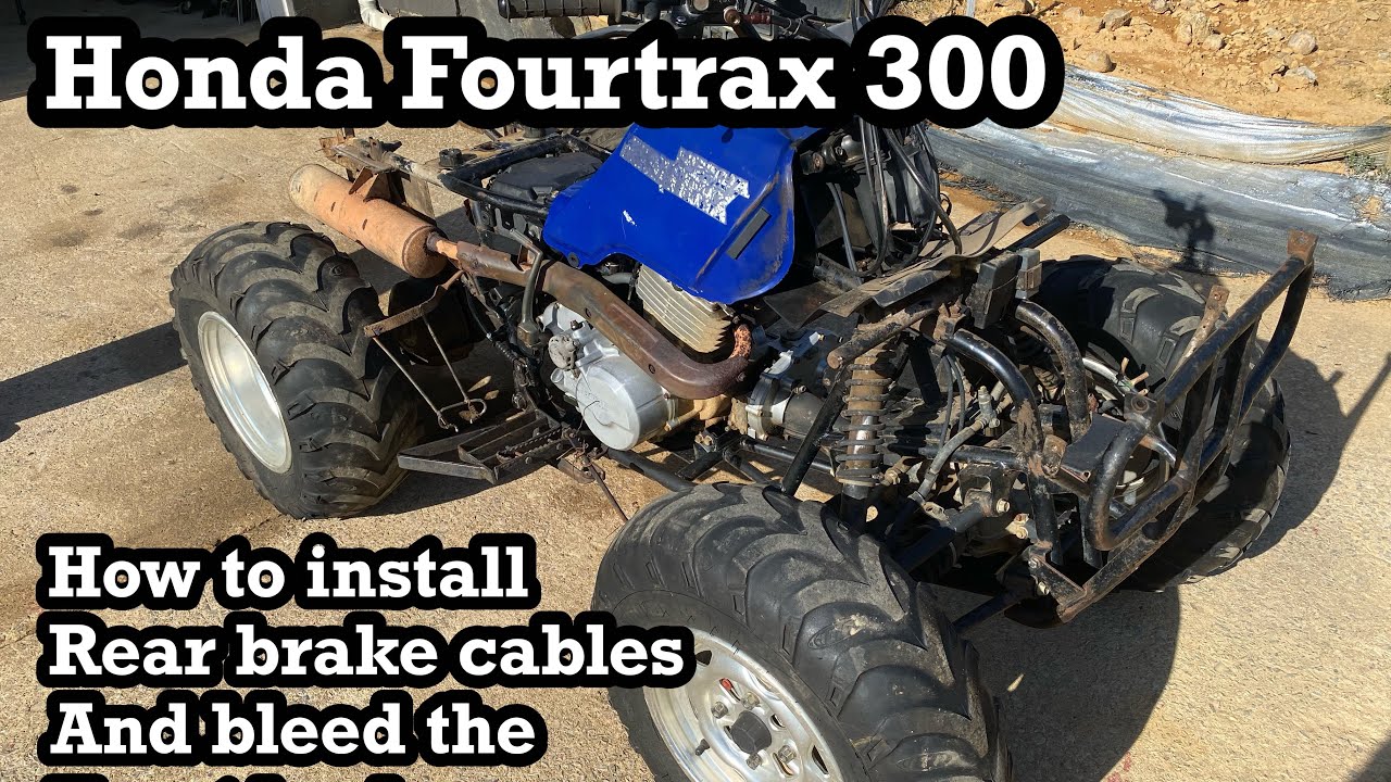 Honda fourtrax 300. Rear brake cable install and bleeding the front brakes. Part #2 of 5