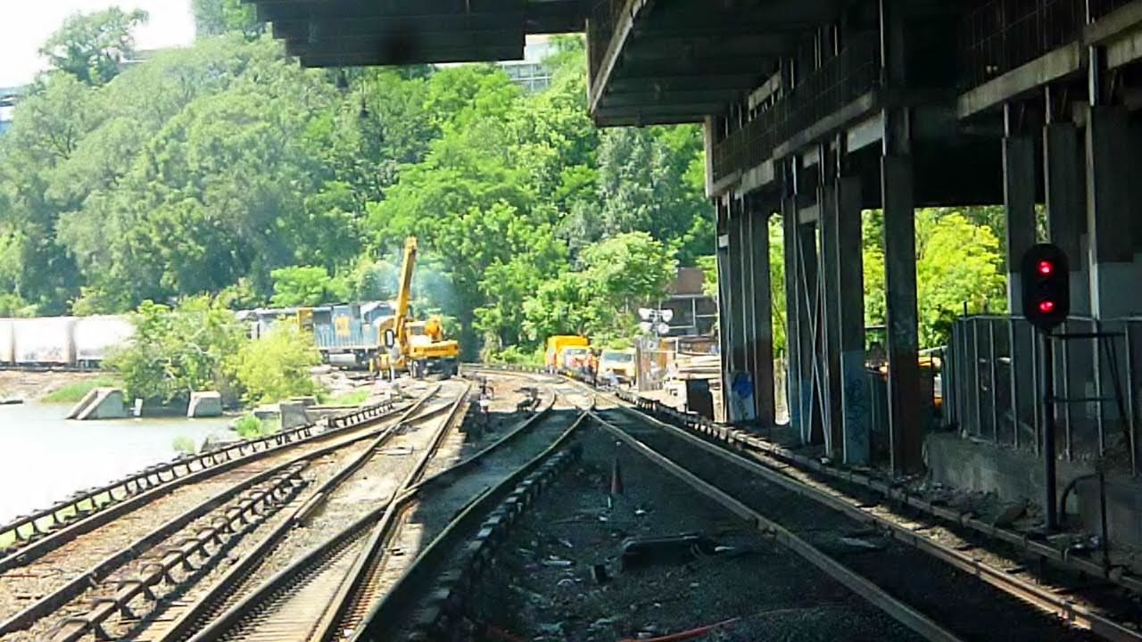 CSX B749 passes Marble Hill  w/female conductor