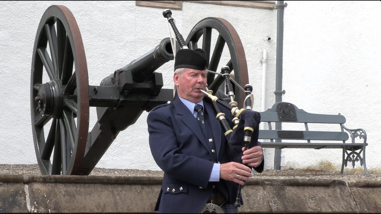 Pipe Major Ian Duncan piping outside Blair Castle during the Atholl Estate Family day in July 2021