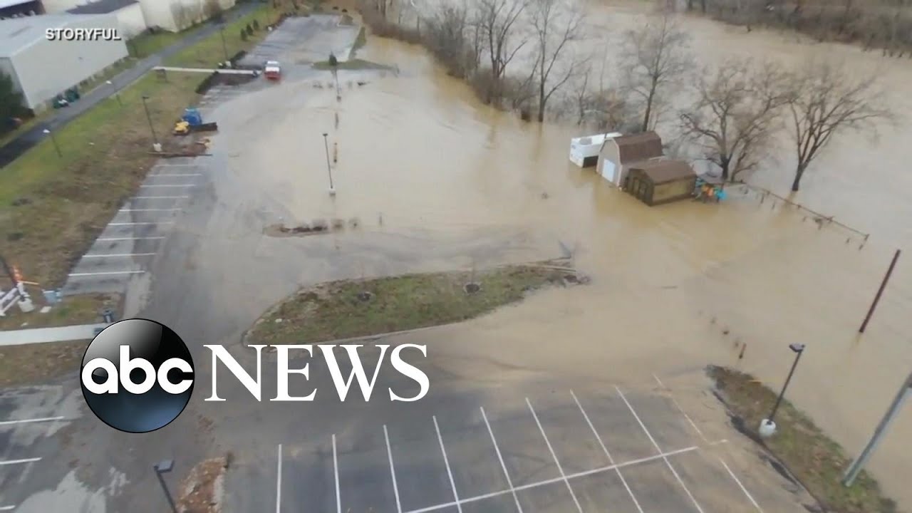 Rising flood waters take over roads, neighborhoods
