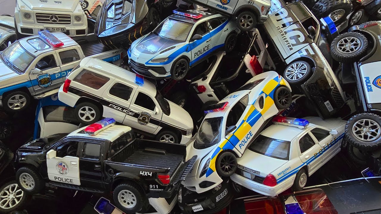 Large collection of model police cars from the box