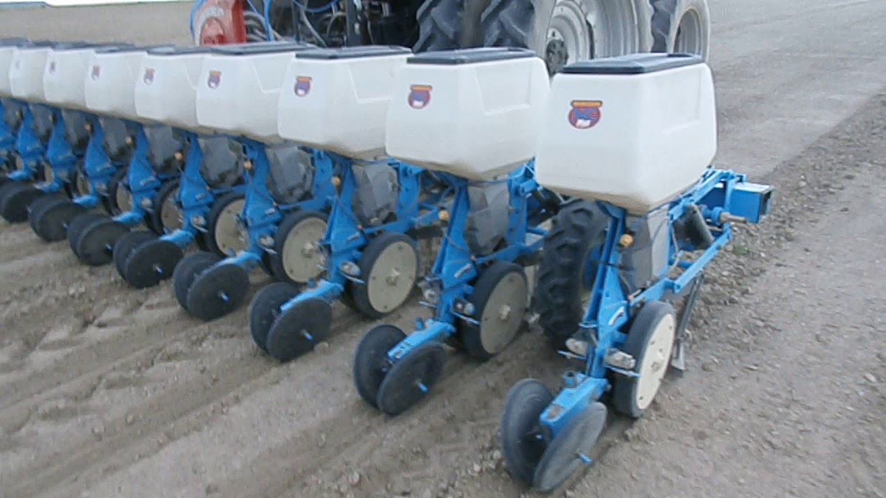 Ploughshare and cutter with seed chute