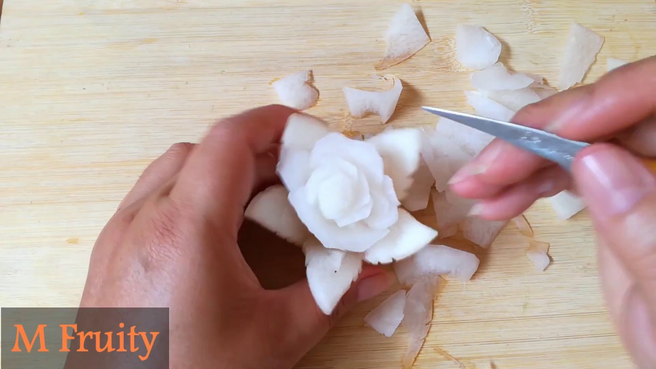 White Radish Carving In Rose Flower Garnish With Cucumber And Carrot