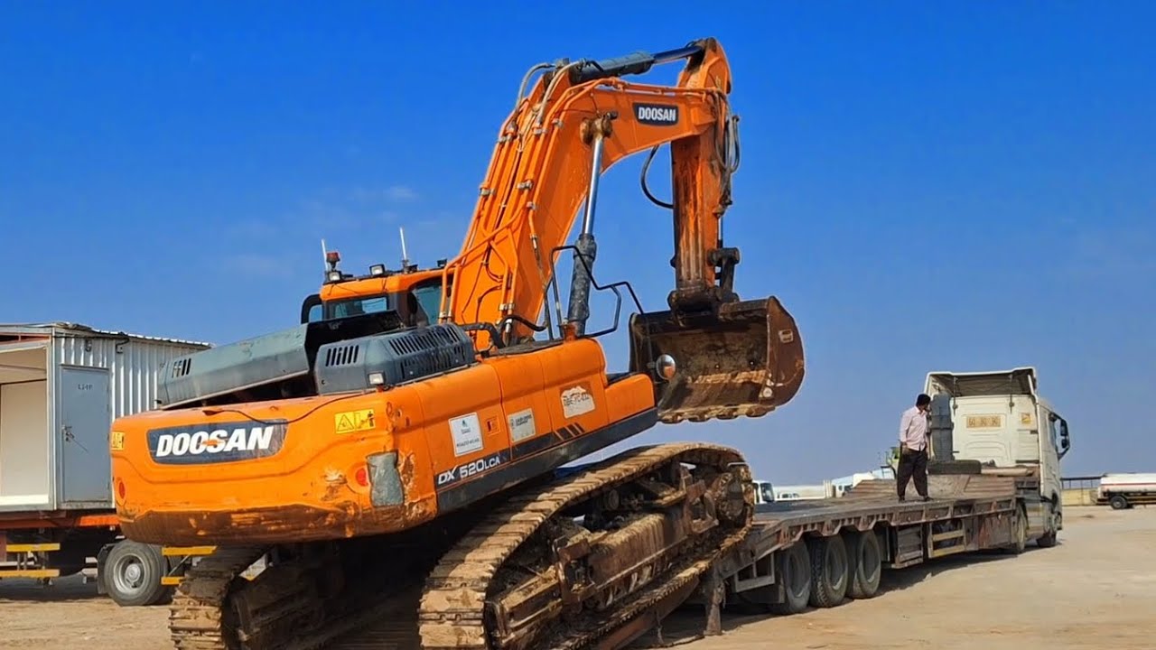 doosan excavator loading on lowbed truck