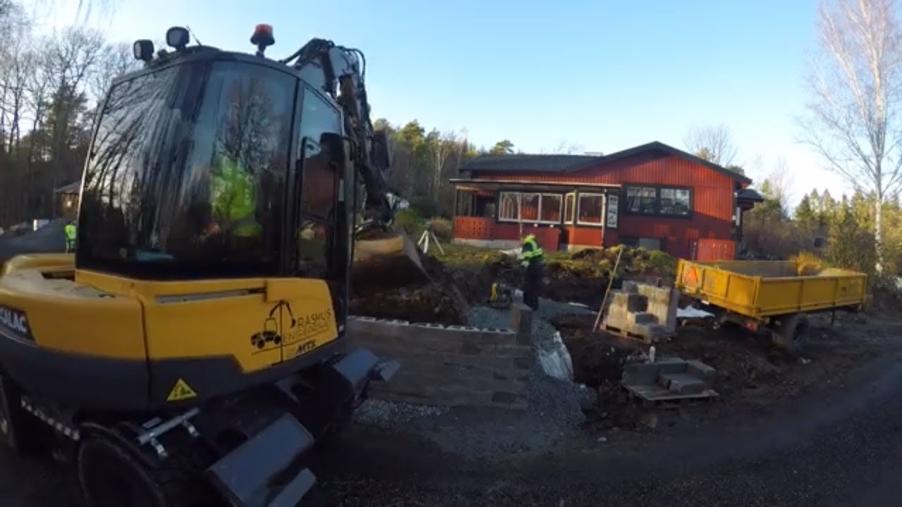 Hardscaping; a retaining wall with Mecalac excavator - Part 1