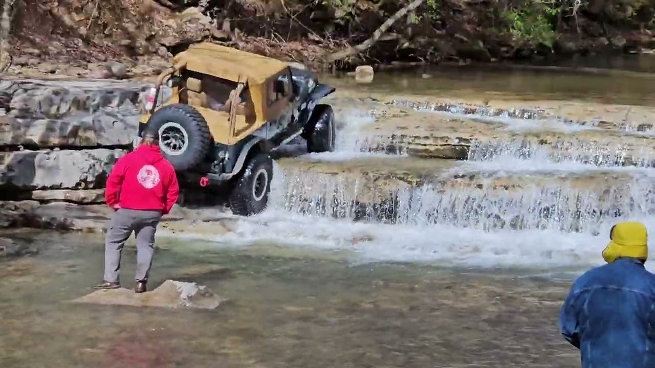 Jeep climbing waterfall