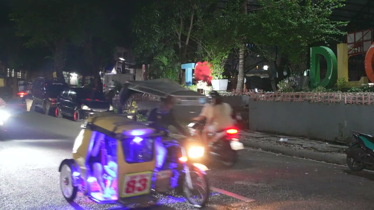 Philippines, tricycle night ride from DLC III to SM