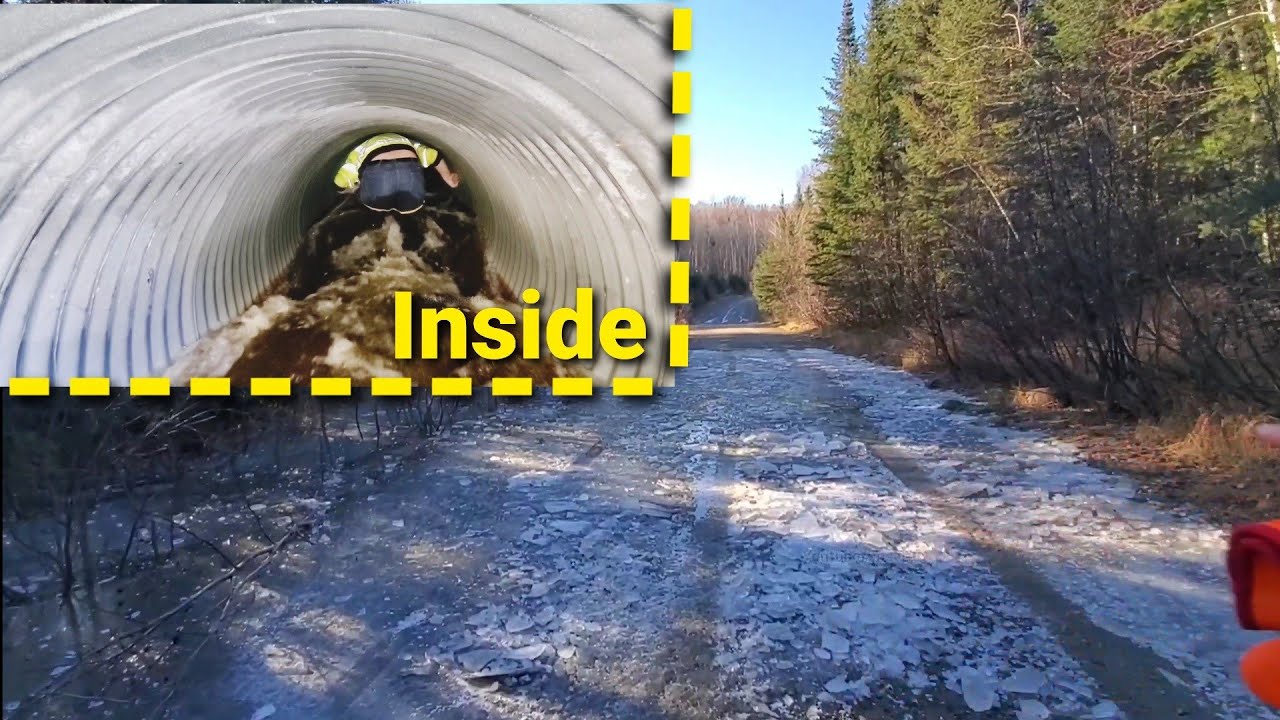 Draining Frozen Street Flood. Culvert Surges
