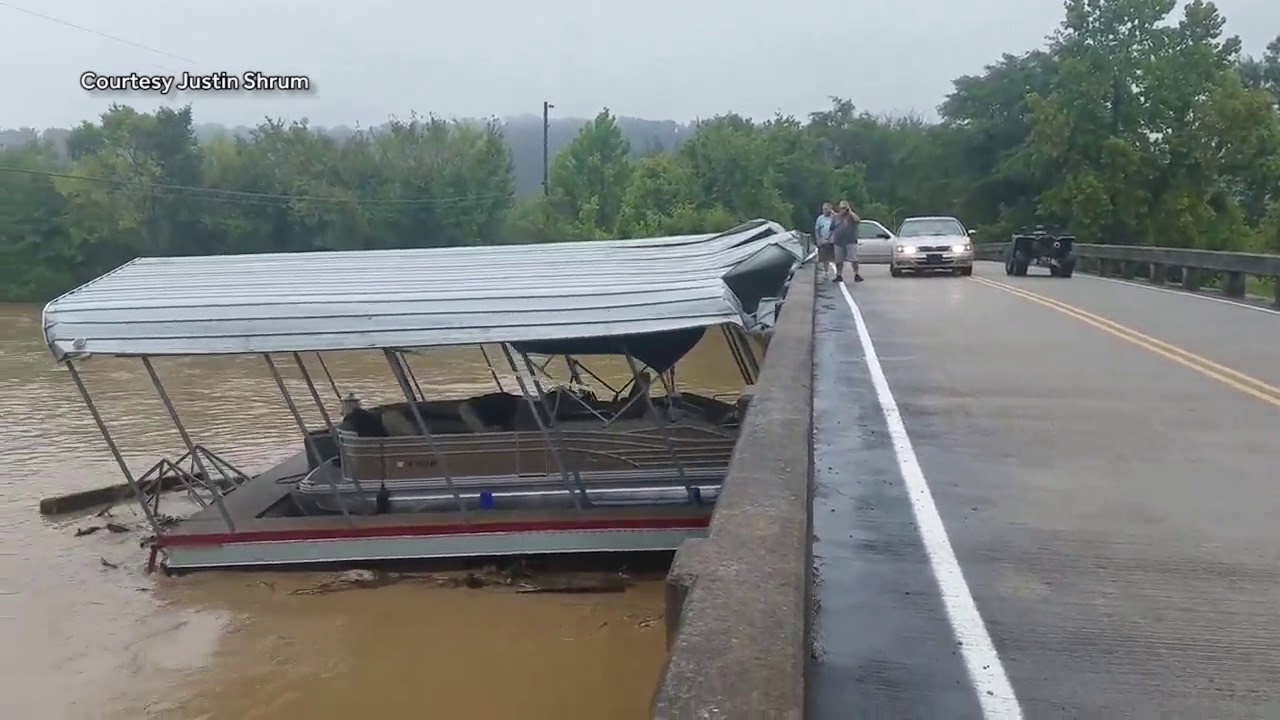Flooding in Tennessee sends boat docks floating down the river, crashing into bridge