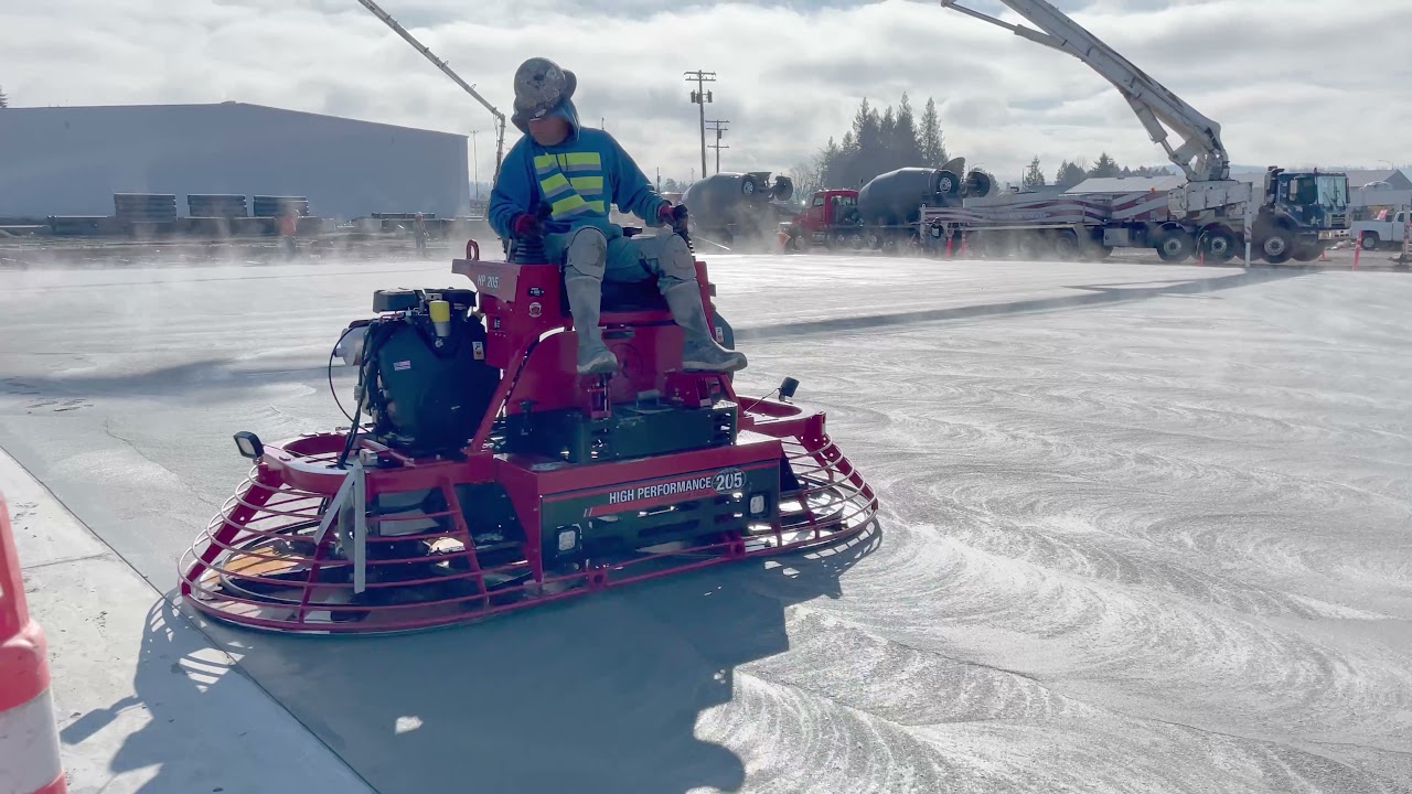 Concrete Finishing, Laser Screed & Rider Trowel putting it down in Western Washington.