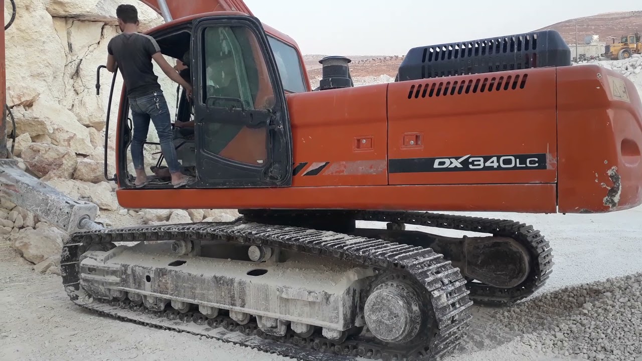 Note the power of this excavator with sunset Doosan 340