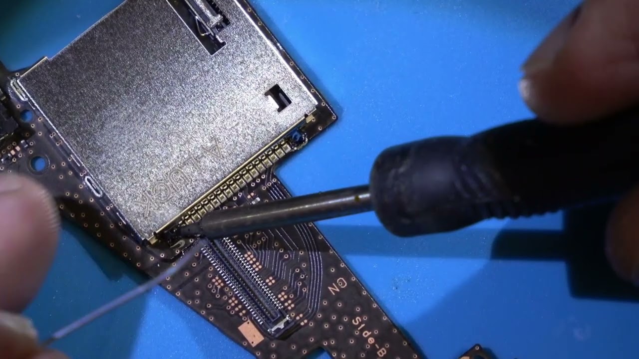 OLED Switch not reading games.  Replacing the game cartridge slot.