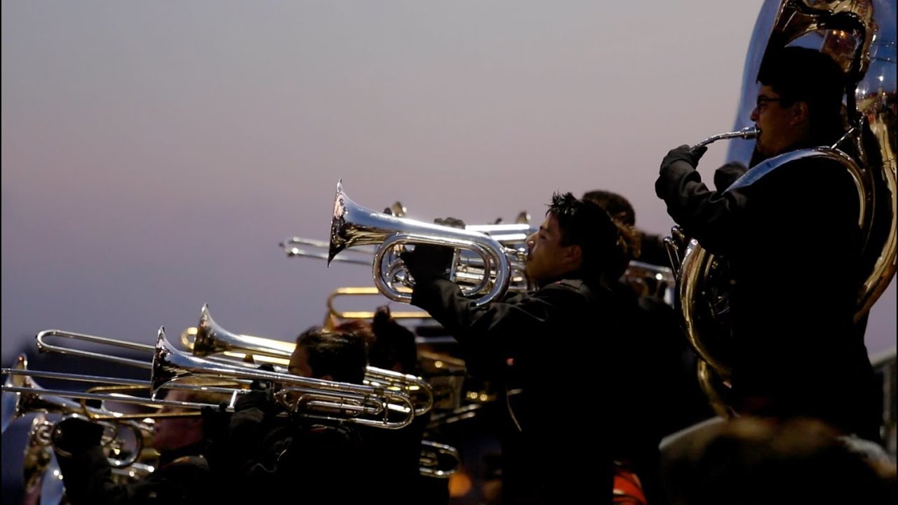 Football rivalry brings Victoria East and West bands together