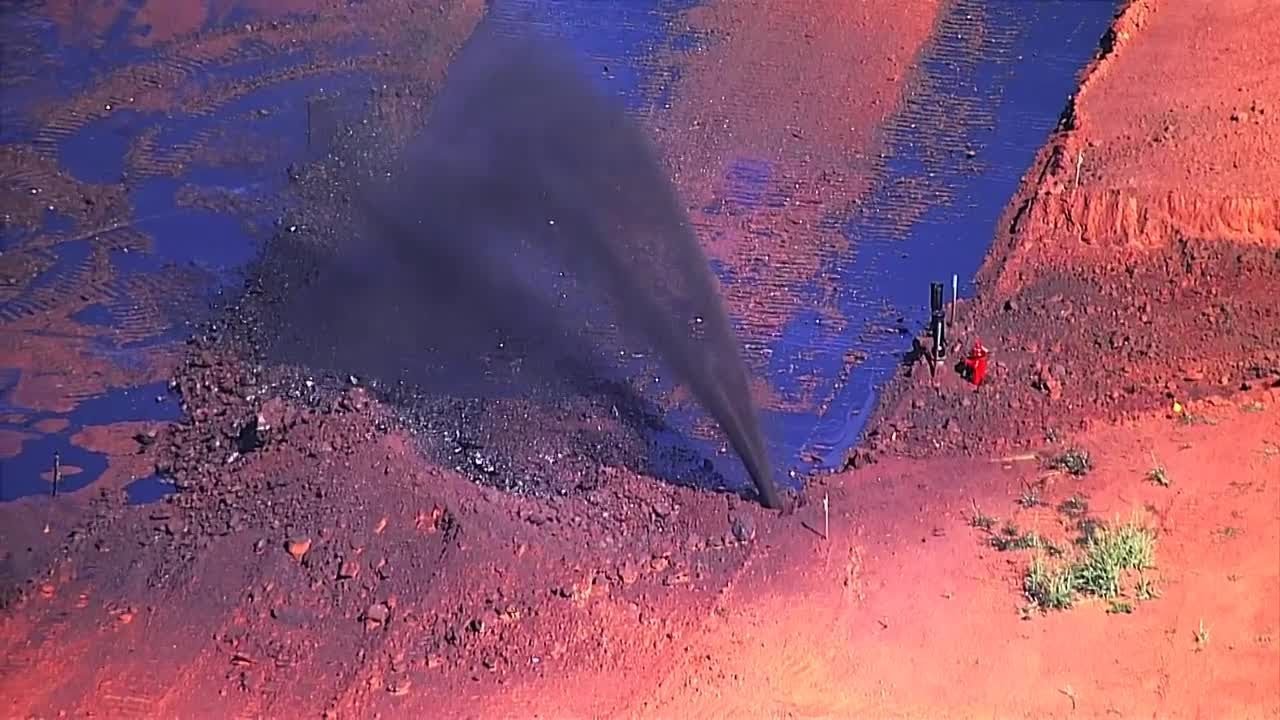 Sky 5 shows oil shooting from the ground near northwest Oklahoma City neighborhood
