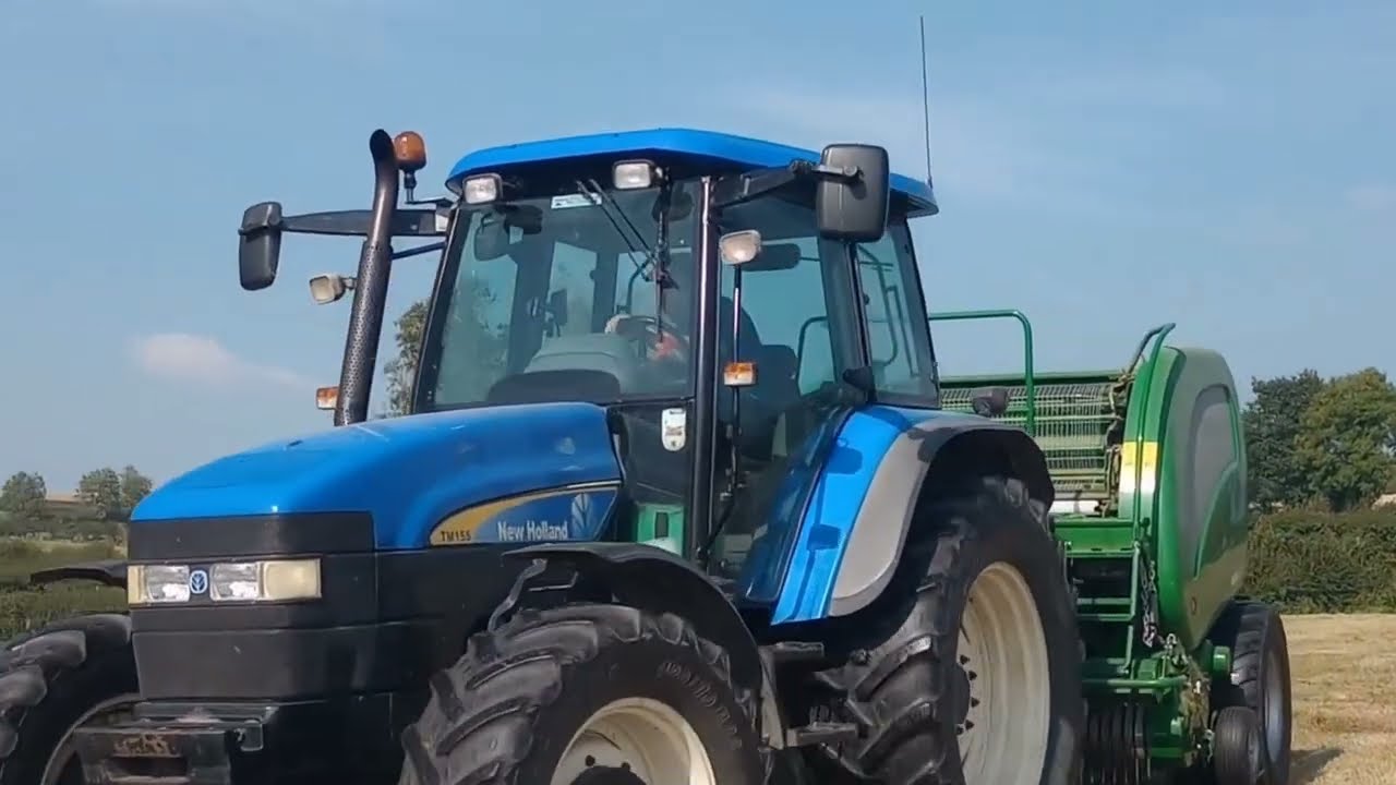 New Holland TM 140 vs TM 155 with McHale F5500 Baler – Raking by John Deere 6330