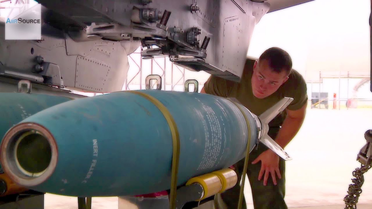 Ordnance Marines Loading Bombs for Harrier Jump Jets