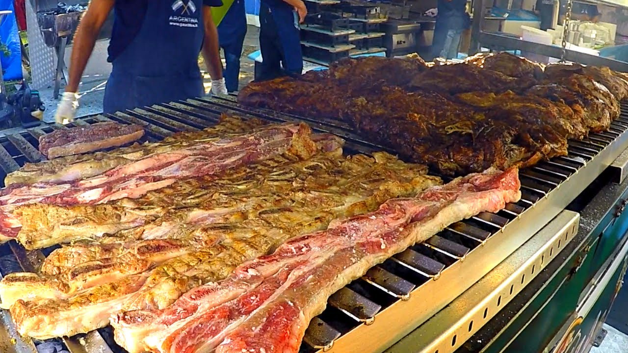 Italy Street Food Event. Huge Blocks of Meat on Grill, Asado, Super Loaded Sandwiches and more Food