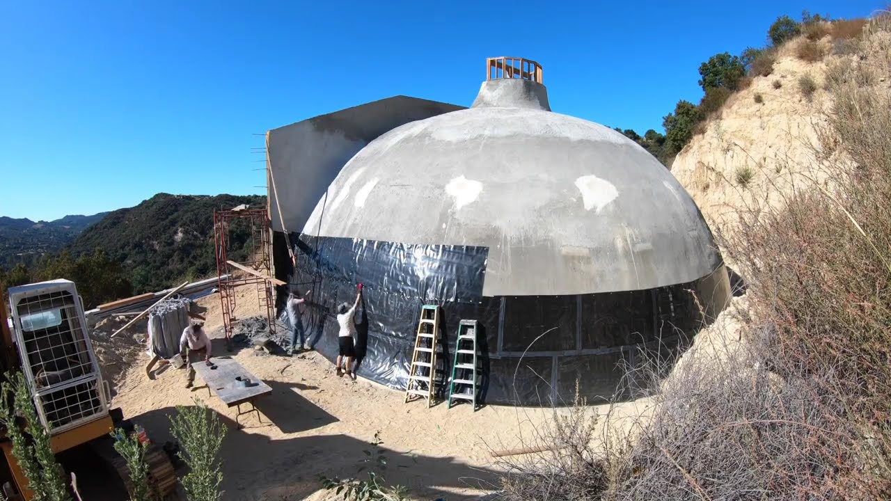 Waterproofing the dome shaped underground house!  WARNING:  LOUD music 10 seconds in. SORRY!