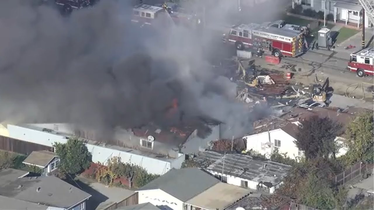 Crews battling large building fire with smoke after reported explosion in Hayward