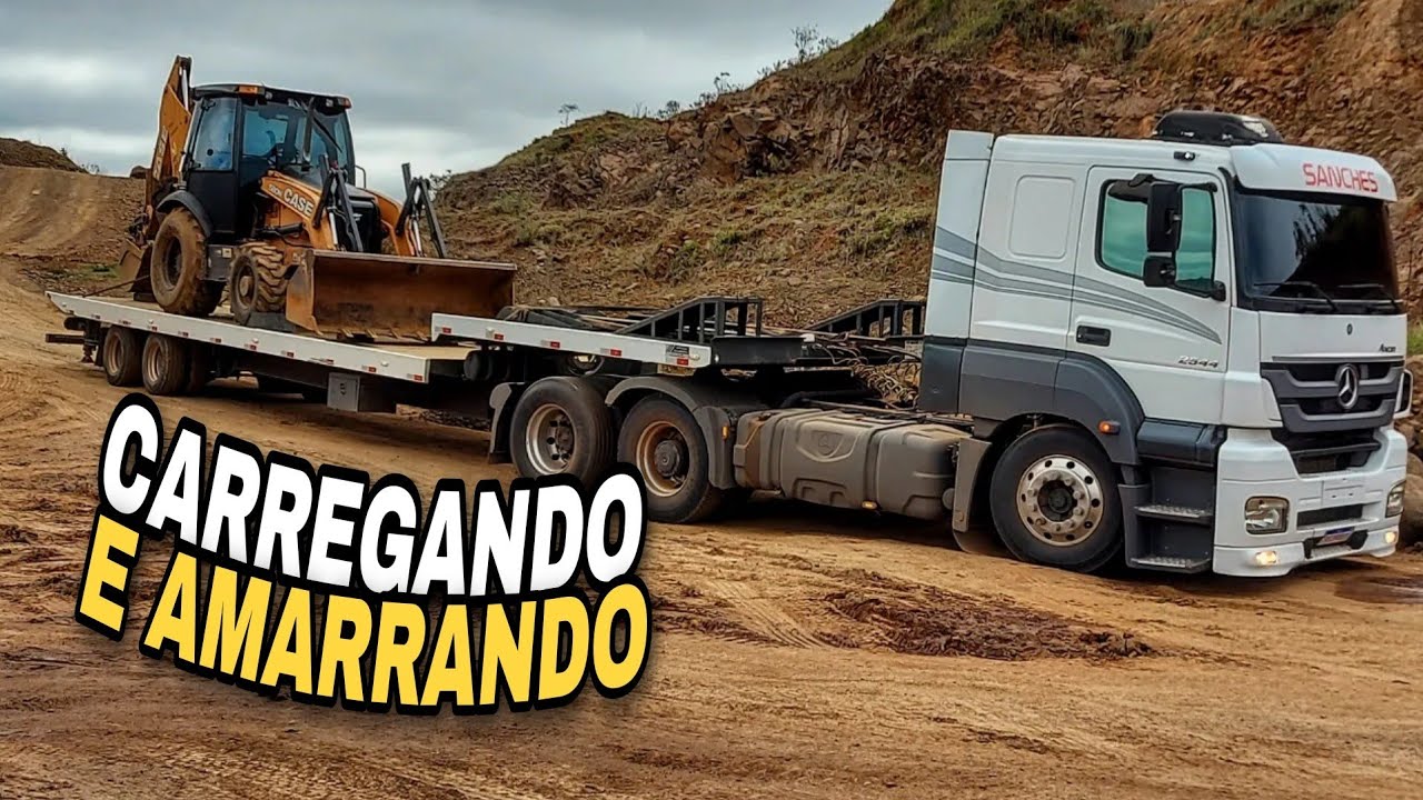 CARREGANDO E TRAVANDO UMA RETROESCAVADEIRA CASE