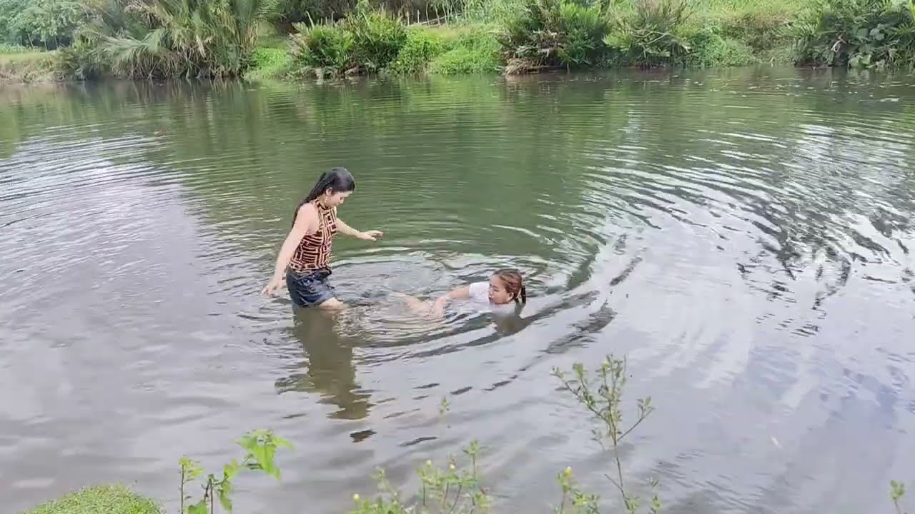 Swimming with my cousin at the river.. Hot day