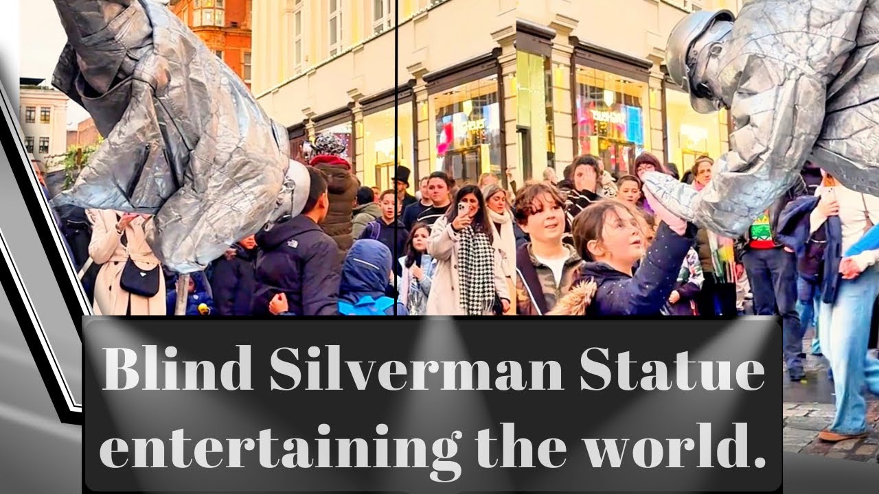 Blind Silverman Statue entertaining the world from the streets of London.