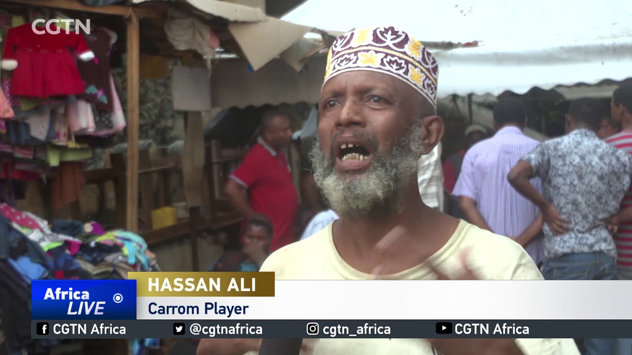 Carrom game helping pass time in the evenings in Kenya's Lamu town