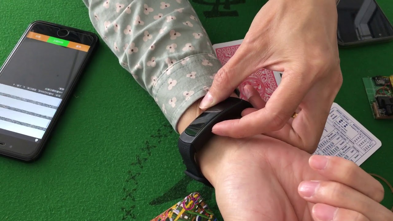 Sports bracelet playing card scanning lens