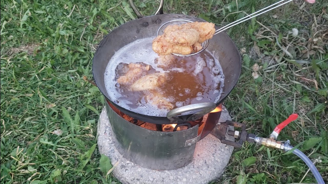 crispy fried chicken wings cooking outdoors