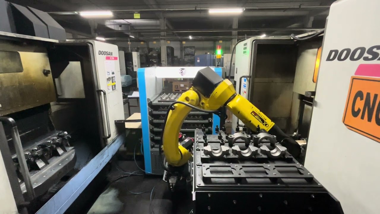 One Doosan VC510 and One Doosan VC500 Machinin Center Tending Application with Fanuc M20ID/35 Robot