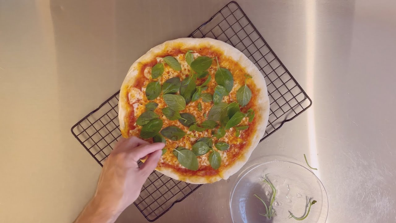 Pizza with fresh basil by Nity