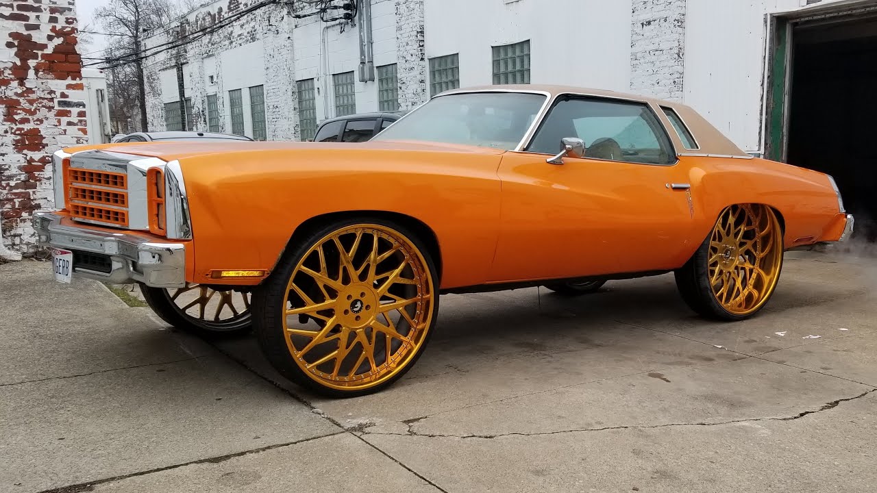 Outrageous Orange Monte Carlo on 30 Inch All Gold Staggered Forgiato’s