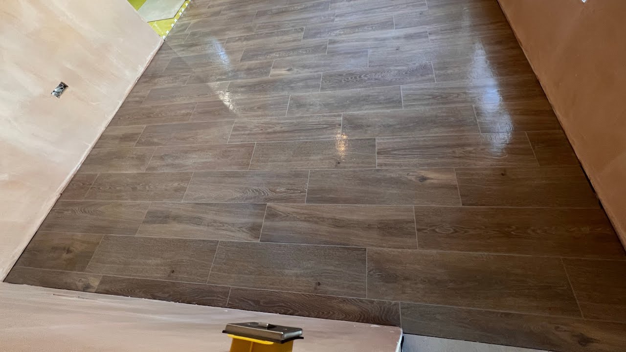 Installation of wood effect tiles.