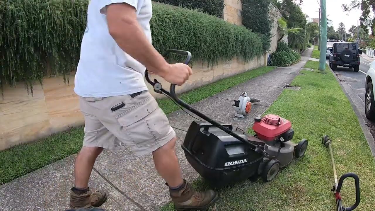 Lawn Mowing and Trimming a sidewalk with my Honda Lawnmower and Stihl Trimmer