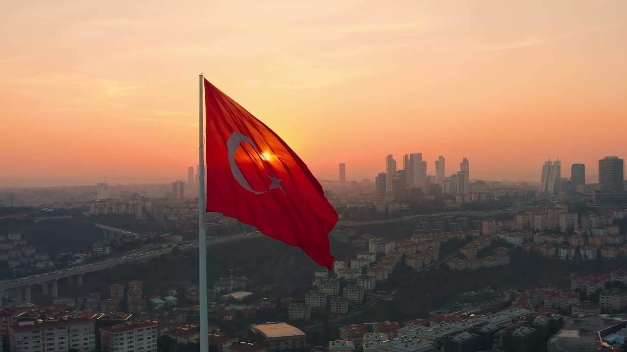 Aeria: Turkish Flag against Istanbul European side with modern skyscrapers