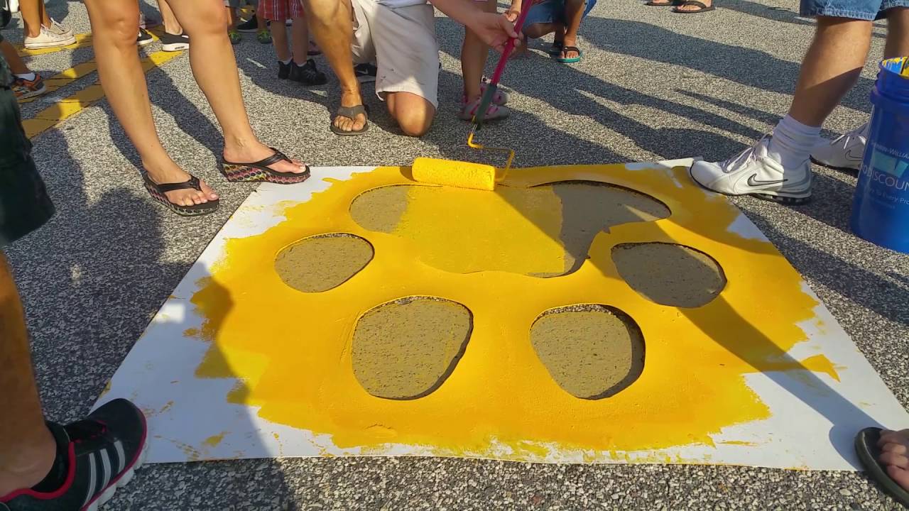 Painting of the PawPrints/ SERVPRO and JAX Chamber