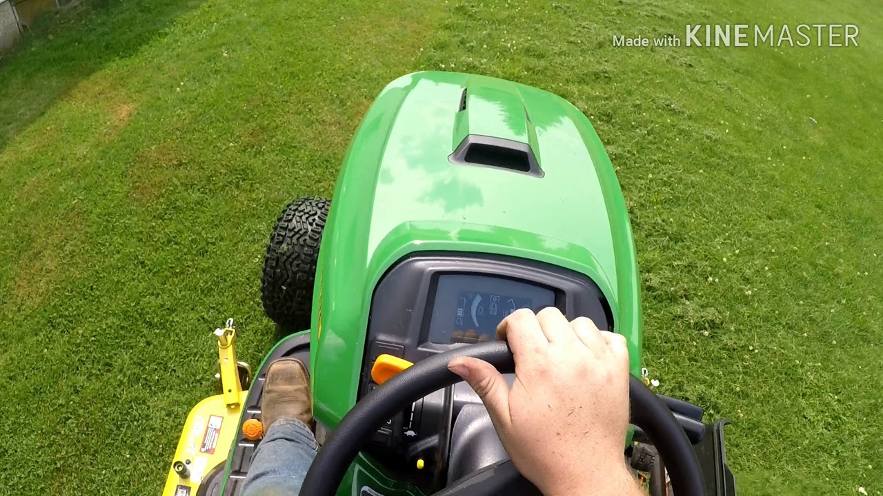 John deere x758 mowing