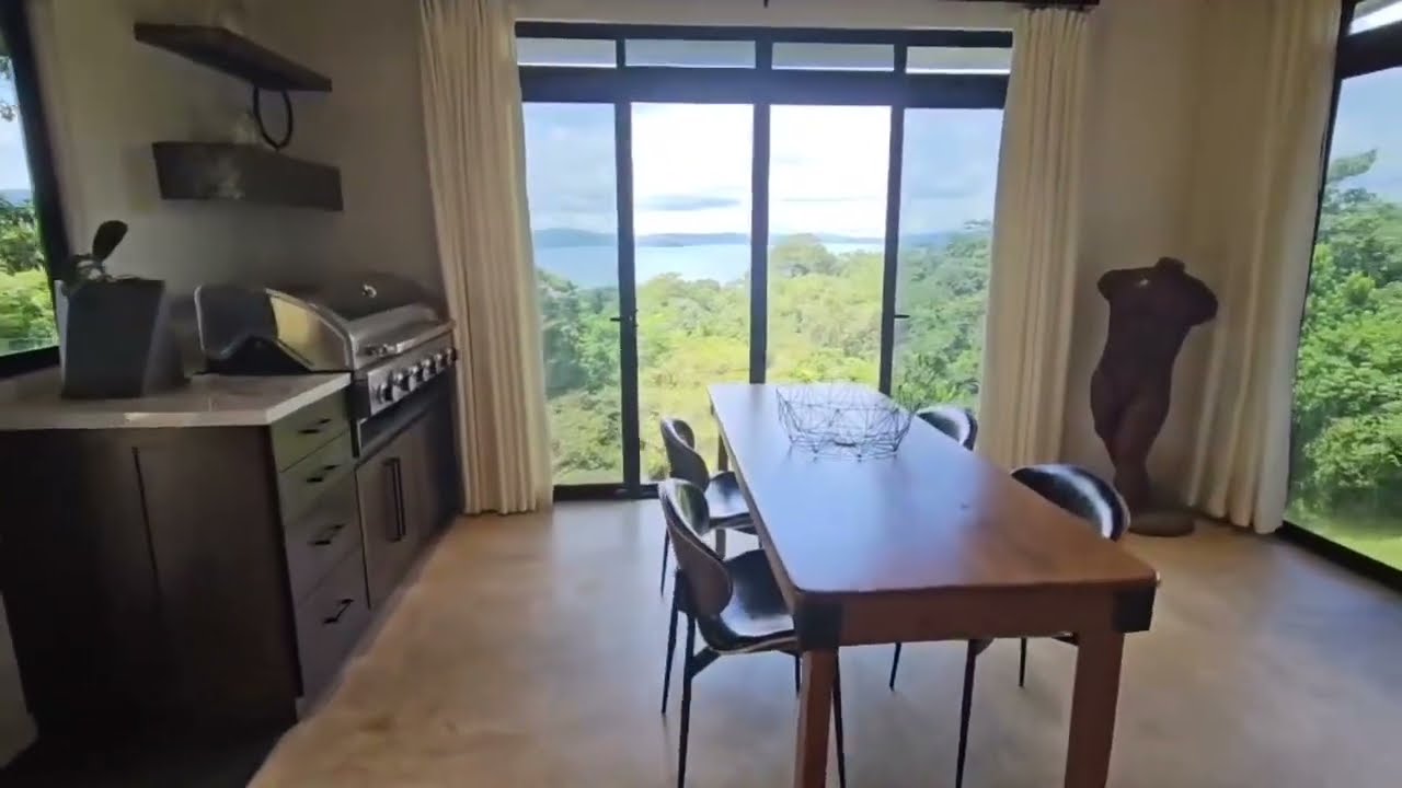 Modern luxury mansion on over 1.75 acres with stunning viewsof Lake Arenal, and multifamily, living
