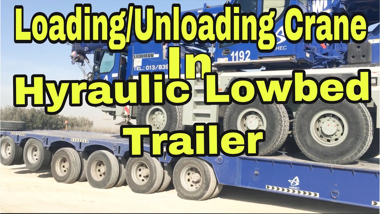 (AMHEC)Loading and unloading crane in the hyraulic lowbed trailer.