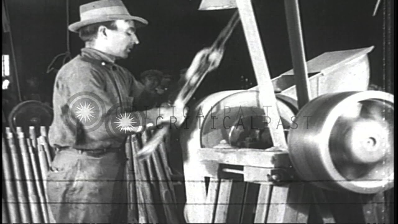 Parts of the Browning machine guns are cut, trimmed, filed and assembled  at a fa...HD Stock Footage