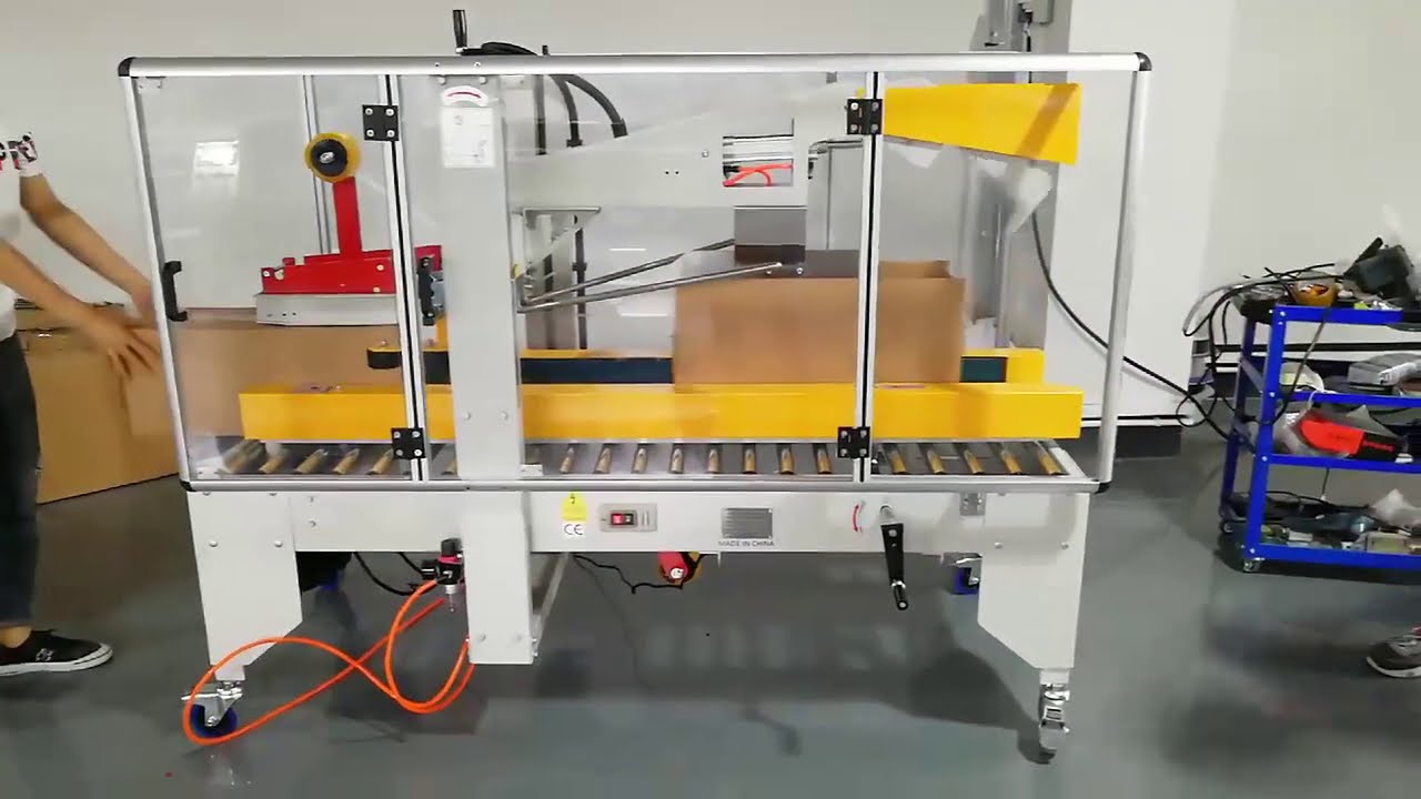 Automatic carton box taping machine