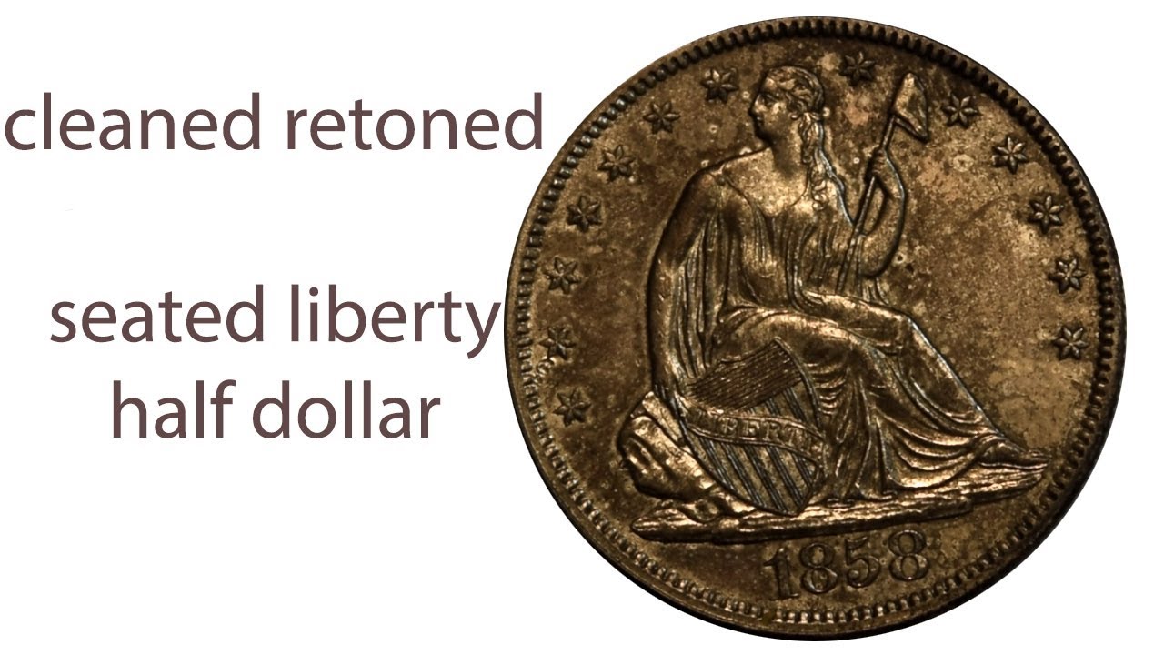 Examining a cleaned and retoned 1858 Seated Liberty Half Dollar
