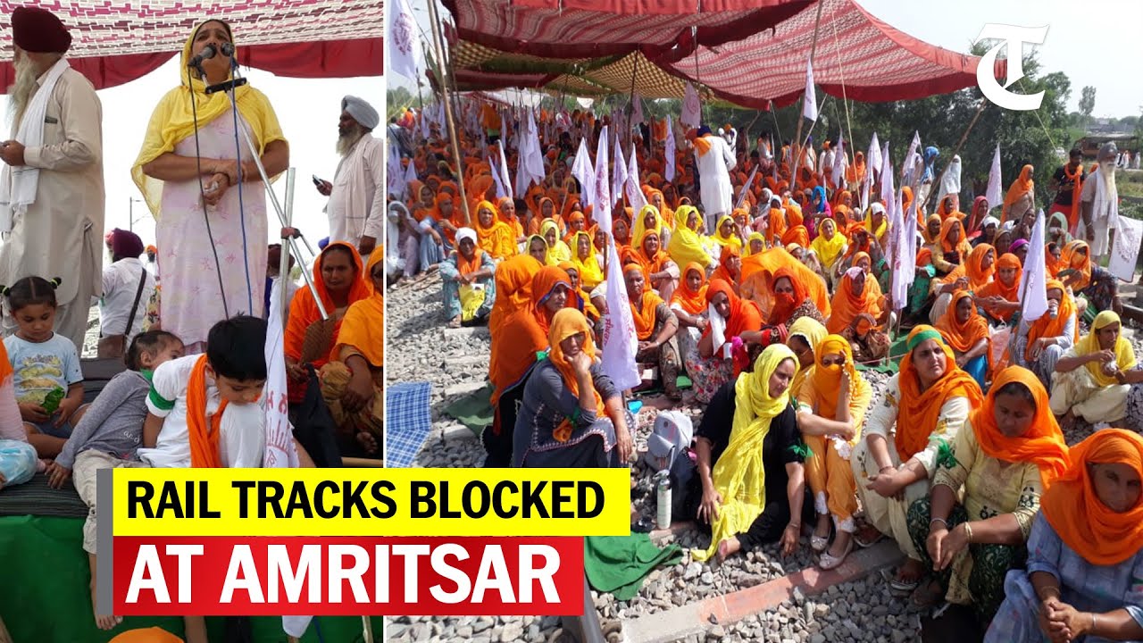 Women members of a farmers organisation block railway track near Amritsar to protest farm laws