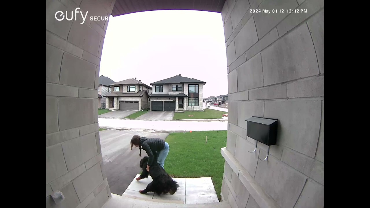 Security camera catches neighbor struggling to get her dog to go back home!