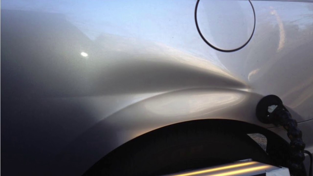 Paintless dent repair on Honda Civic coupe quarter panel