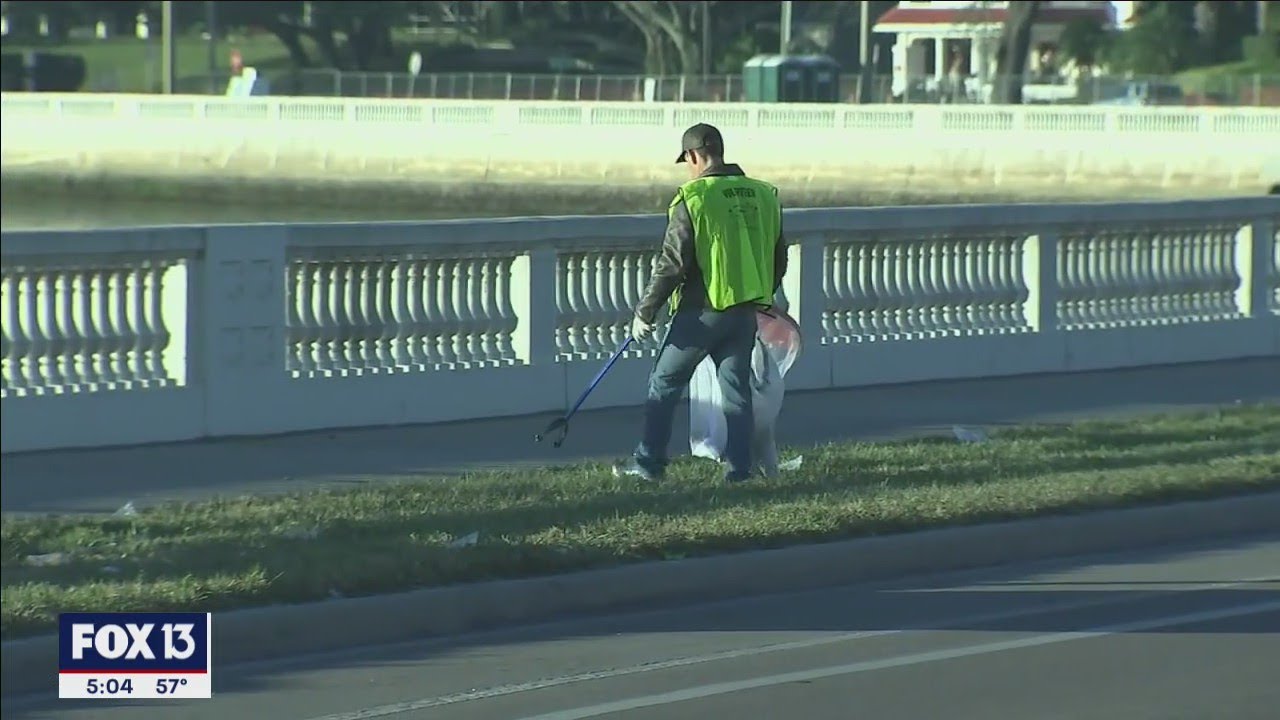 Gasparilla parade cleanup volunteers remove beads, beer bottles and booty along Bayshore