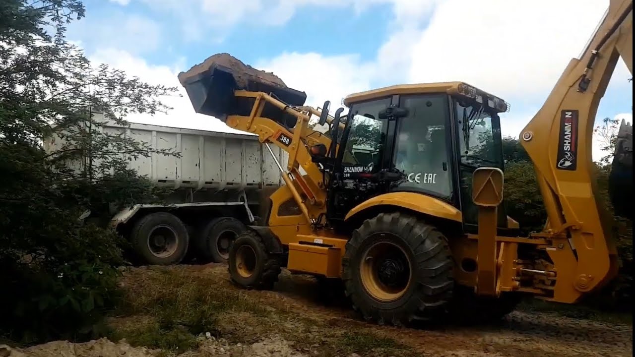 mostrando detalhes da retro escavadeira SHANMON 388
