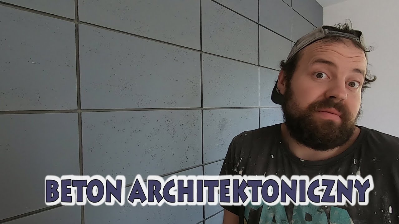 Beton architektoniczny na ścianie z TV