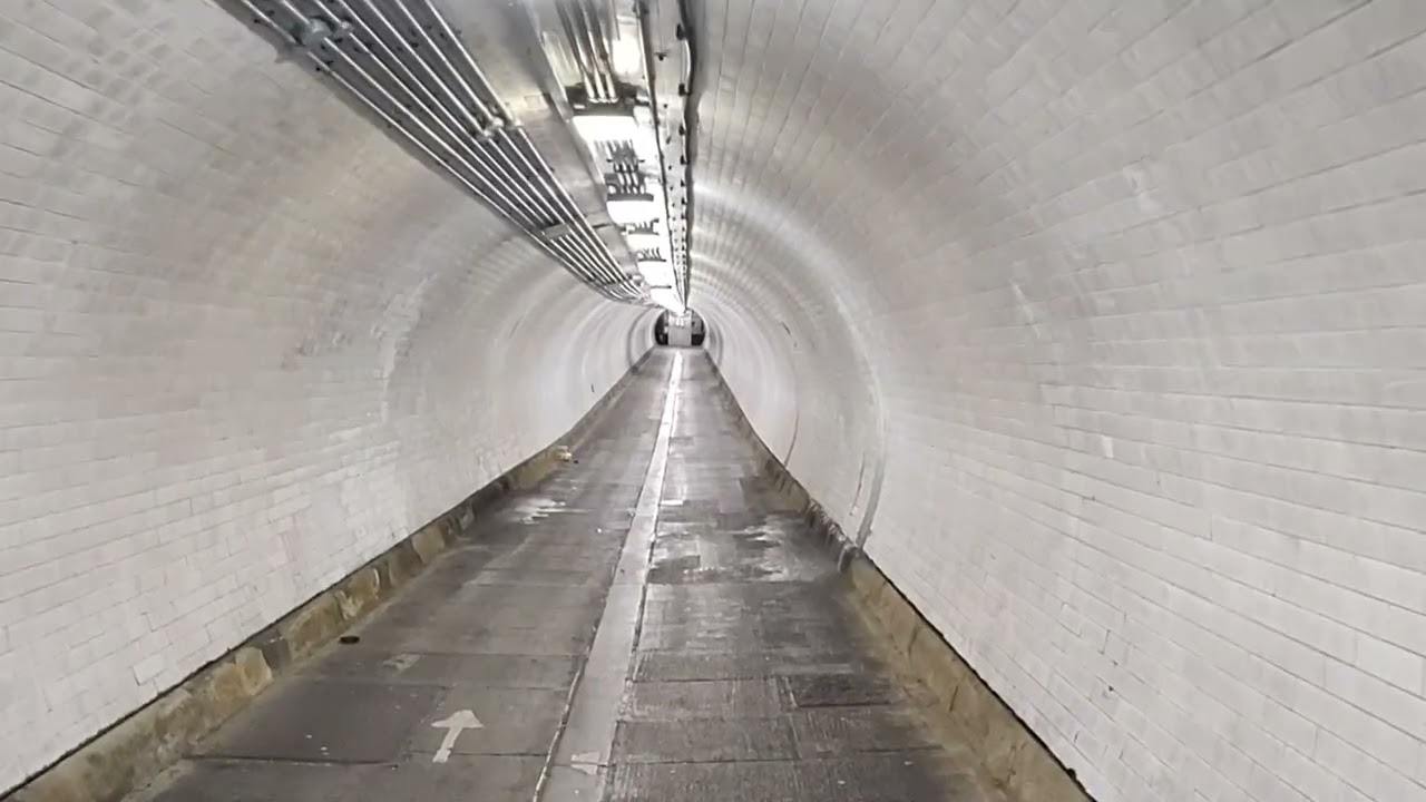 Woolwich foot tunnel Underground the River Thames. Around 1660 Feet long long and 100 steps down.