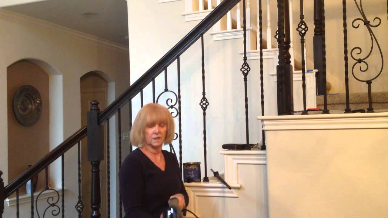 Staircase Upgrade installing iron balusters